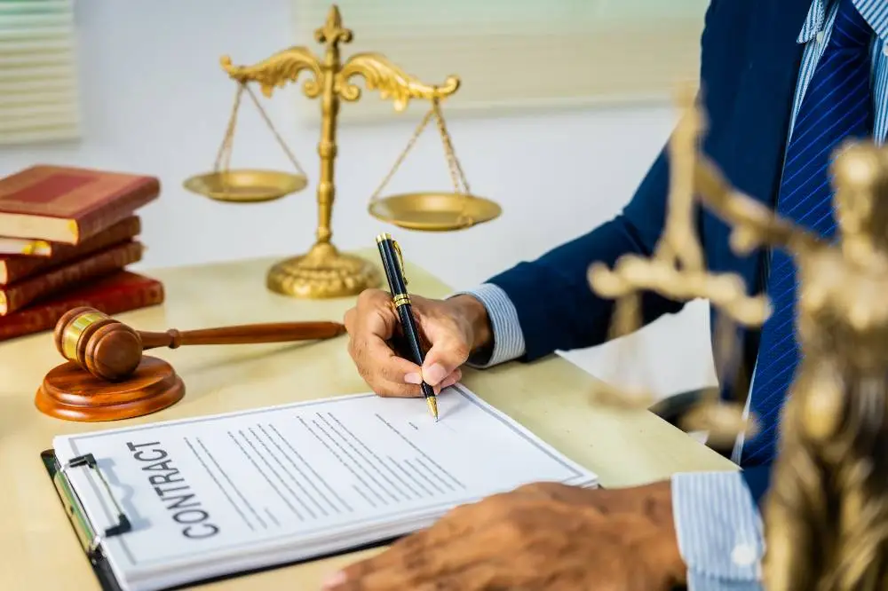lawyer signing a contract